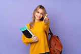 Fototapeta  - Teenager Russian student girl isolated on purple background shaking hands for closing a good deal