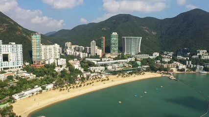 Wall Mural - Aerial footage of the famous Repulse Bay beach and residential tower in the south of Hong Kong island on sunny day in Hongkong SAR, China