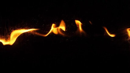 Wall Mural - slow motion speed closeup scene on burning pattern rise up on black grunge floor background, fast sp