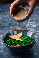 Sticker - Chuka laminaria seaweed salad with lime on plate