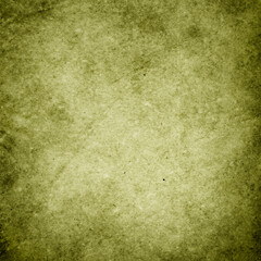 Green grunge background, texture of rough old paper in spots and streaks