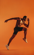 Side View Of Male Athlete Running