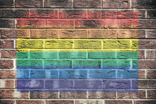 Gay Pride Rainbow Flag On Brick Wall Background