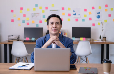 The executives of the company sit on the desks in the office. He is the leader in startup. Boss of new company. Businessman growth launch concept