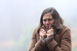 © Antonioguillem - Stressed middle age woman getting cold in winter outdoors