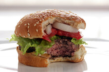 Close Up Of Hamburger With Lettuce And Tomato