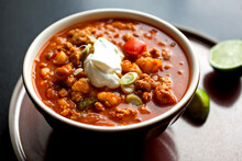 Gourmet Food Photograph Of Hominy Chili In Bowl