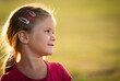 © Dusan Kostic - Portrait of cute pretty child girl outdoors on blurred sunny colorful bright background.