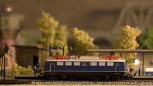 Miniature Retro Train Model On A Station Signalman And Passangers. Toy Plastic Railway Model.
