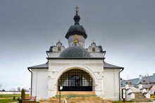 The Main Entrance To The White-stone Orthodox Cathedral With Black Domes And Golden Crosses