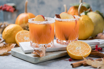 pumpkin punch or sangria in a glass with apple, cinnamon. Halloween and Thanksgiving. Traditional autumn, winter drinks and cocktails