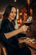 © eastwest photo - woman toasting with glass of wine