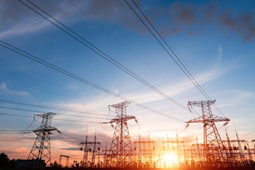 Wall Mural - electrical substation silhouette on the dramatic sunset background