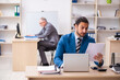 © Elnur - Two male colleagues working in the office