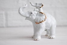 Elephant With Baby Elephant White Porcelain Figurine On A White Background
