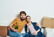 © SHOTPRIME STUDIO - cheerful young couple boxes with things interior room tools moving