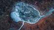 © Yakov Knyazev/Stocksy - Frozen lake in the middle of the forest