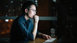 © JIACHUAN LIU/Stocksy - Businessman working in night