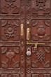 © Yakov Knyazev/Stocksy - old wooden door in Nepal, decorated with traditional ornament