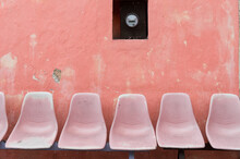 A Row Of Empty Seats On A Bus Stop In Mexico