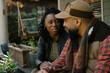 © Melissa Alexander/Creative Flame - Beautiful black couple talking on front porch at home
