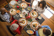 © Lynsey Weatherspoon/Creative Flame - Family eating Christmas meal together