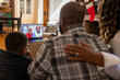 © Lynsey Weatherspoon/Creative Flame - Family having a video chat  with grandparents on laptop at home for Christmas