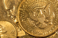Stack Of American Gold Coins Background. US Half Dollar Coin With Eagle. Concept Of A Stable Banking System And Economy.