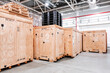Wooden boxes in the warehouse. Boxes out of wood for packing industrial machinery. Warehousing. Packaging of finished products of the plant. Sale of packaging materials.