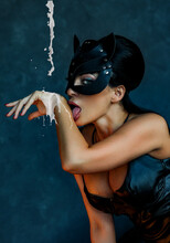 Sexy Girl In Leather Cat Mask Licks Milk