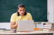 © Elnur - Young male student preparing for exams in the classroom