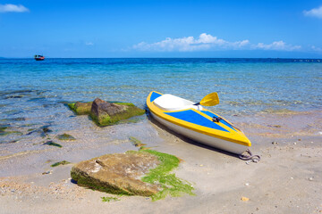 Wall Mural - Kayak is anchoring on the beach in Phu Quoc island, Kien Giang province, Vietnam.