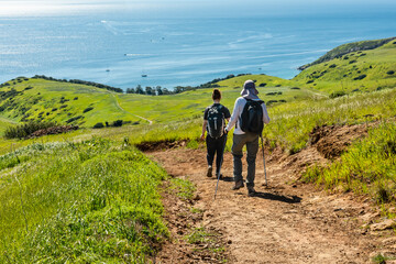 hikers on smugglers road on santa cruz island, channel islands national park, california