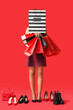 © Pixel-Shot - Beautiful African-American woman with shopping bags and shoes on color background. Black Friday sale