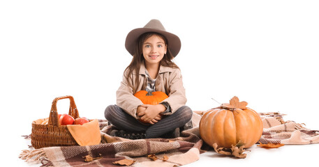 Canvas Print - Cute little girl in autumn clothes and with pumpkins on white background