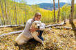 © Mint Images - teenage girl embracing her English Cream Golden Retriever