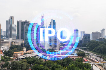 Wall Mural - IPO icon hologram over panorama city view of Kuala Lumpur. KL is the hub of initial public offering in Malaysia, Asia. The concept of exceeding business opportunities. Double exposure.