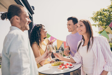 Poster - Portrait of company of four funny fellows arms hold champagne clink positive vibes meeting outdoors