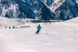 Fototapeta Natura - People ski and snowboard at a beautiful resort in the mountains of Georgia