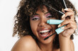Beautiful joyful african american girl posing with mascara