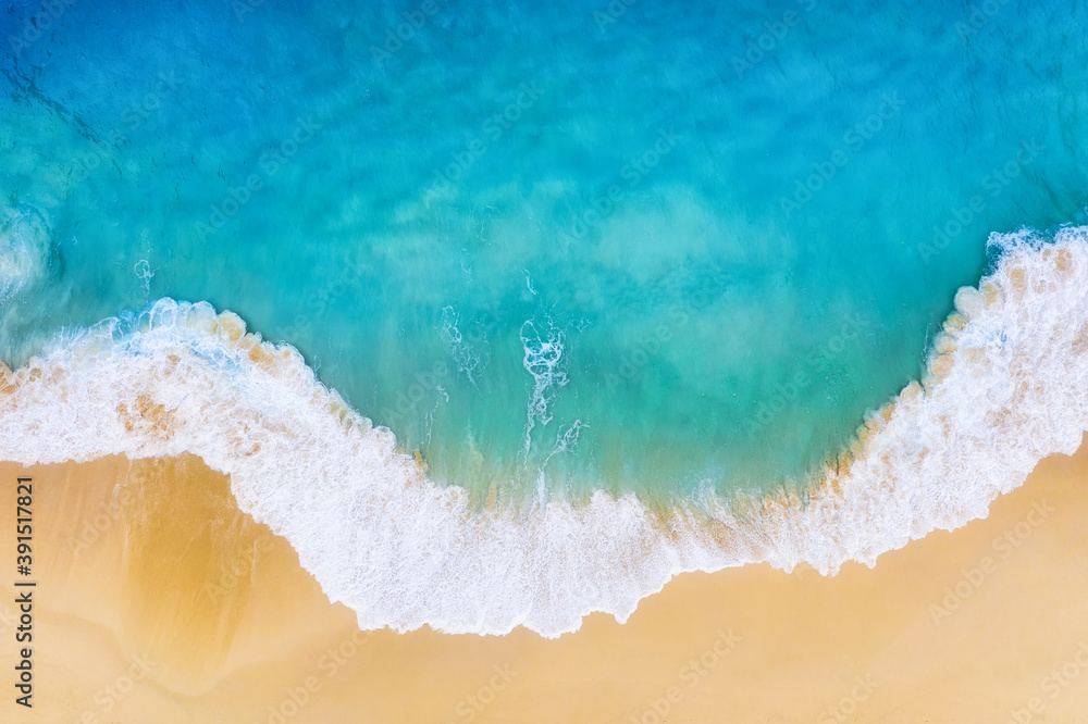 Beach and large ocean waves. Coast as a background from top view. Blue water background from drone. Summer seascape from air. Travel image - obrazy, fototapety, plakaty 