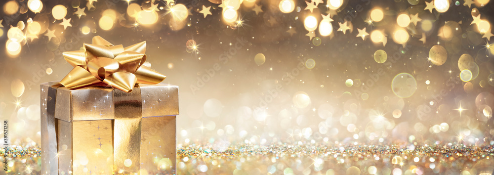 Golden Gift Box On Glitter In Abstract Background With Defocused Lights - obrazy, fototapety, plakaty 