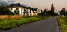 Street With A Row Of Houses At Suburbia.