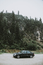 Black Car In Winter Landscape
