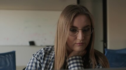 Wall Mural - the programmer girl works at the computer girls in science. in an empty office during a pandemic.