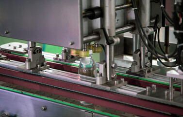 Poster - Liquid bottle filling and packing machine in food industry