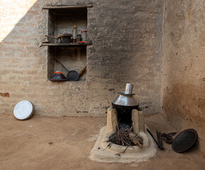 an old hand made clay stove and untensiles in the house of rajasthan.