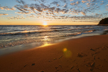 sunset on the sandy beach of the gulf of finland