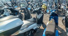 A Lot Of Scooters In A Parking
