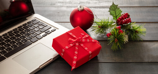 Christmas, office closed. Laptop and xmas decoration, blue background